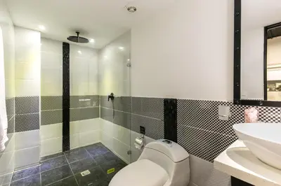 a bathroom with a toilet and a sink at Provenza Lofts in Medellín