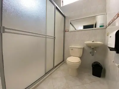 a bathroom with a toilet and a sink at Ayenda 1228 Balcones de la 70 in Medellín