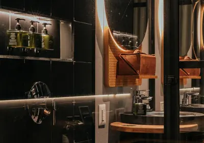 a bathroom with a sink and a mirror at The Click Clack Hotel Medellín in Medellín