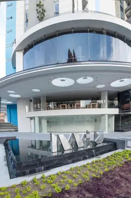 a large building with a lot of windows at Inntu Hotel in Medellín
