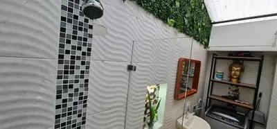 a bathroom with a shower with a toilet and a sink at Studio cerca a estacion metro poblado in Medellín