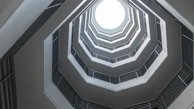 an overhead view of a spiral staircase in a building at Hotel Benidorm in Manizales