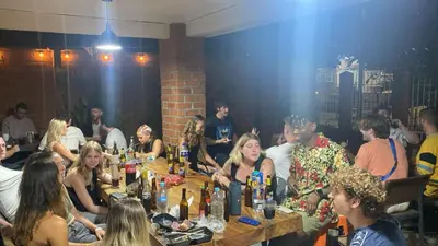 a group of people sitting at tables in a room at Black Sheep Medellin in Medellín