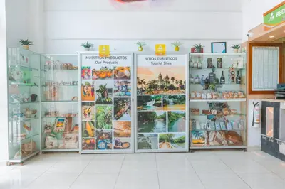 a store with a bunch of pictures on the wall at Hotel Shaira 2 in Quibdó