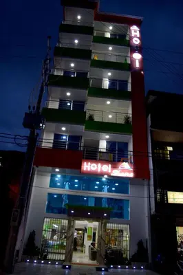 a hotel with a neon sign in front of it at Hotel Shaira 2 in Quibdó