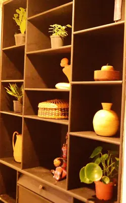 a book shelf filled with lots of pots and pans at Africa house-Casa Hotel Laureles-La70 in Medellín