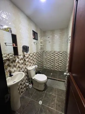a bathroom with a toilet and a sink and a shower at Apartamento Ángel Namaste in Bello