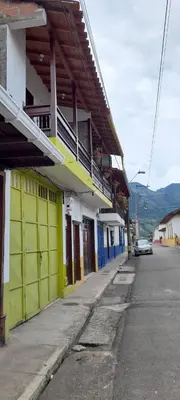 a yellow and blue building on a city street at Rosita 2 in Jardin