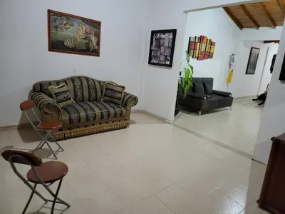 a living room with a couch and two chairs at Rosita 2 in Jardin