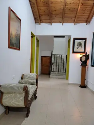 a room with a bed and a door in it at Rosita 2 in Jardin
