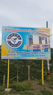 a sign for a bicheno a beaten up united at Hotel La Posada in Belén de Umbría