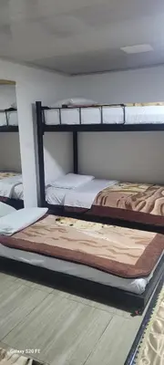 two bunk beds sitting in a room with at Hotel La Posada in Belén de Umbría