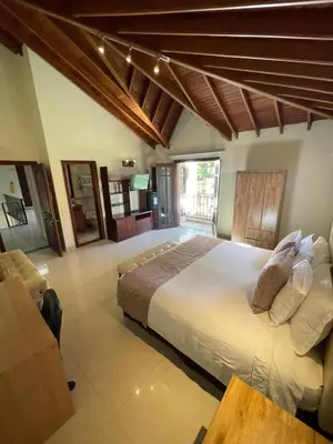a large bedroom with a large bed in a room at Villa de los Angeles in Medellín