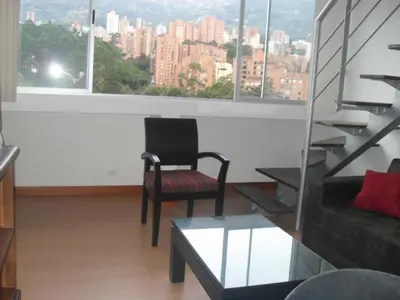 a living room with a view of a city at Rent Apartment Furnished an alcove in Medellín
