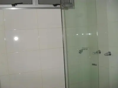 a shower with a glass door in a bathroom at Rent Apartment Furnished an alcove in Medellín