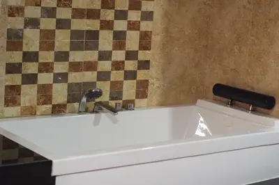 a white bath tub with a faucet in a bathroom at Hotel el imperio in Quibdó