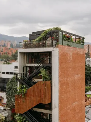 a building with a garden on top of it at The Somos Beats Hotel & Rooftop in Medellín