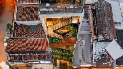 an overhead view of a building with a balcony at The Somos Beats Hotel & Rooftop in Medellín