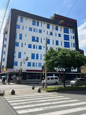 a hotelachiachiachi building on the corner of a street at Hotel Portal Central in Medellín