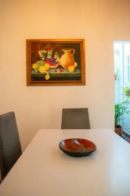 a table with a vase sitting on top of it at 5STARHOMES - Estilo y confort en Laureles in Medellín