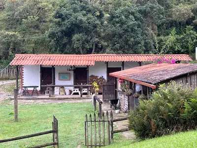 a small house with a fence in front of it at Mini ISABELITA in El Retiro