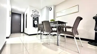 a dining room with a table and chairs at Apto Moderno en Laureles in Medellín