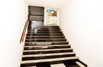 a staircase in a building with black and white tiles at Ayenda 1131 Casa Valencia in Manizales