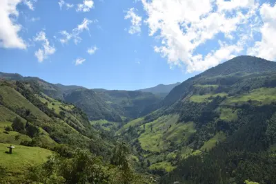 a view of a valley in the mountains at Creo Ecolodge Jardín in Jardin