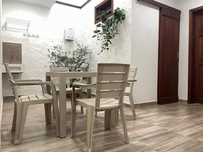 a dining room with a table and chairs at Apartamento cerca a cascada del Amor,Wifi in Jardin