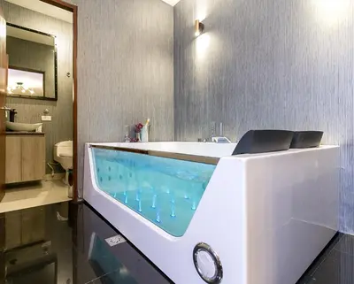 a bathroom with a tub with a sink at Viktory Boutique Hotel in Medellín