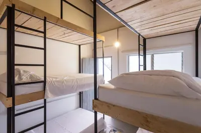 a bedroom with two bunk beds in a house at Gastón Coliving in Medellín