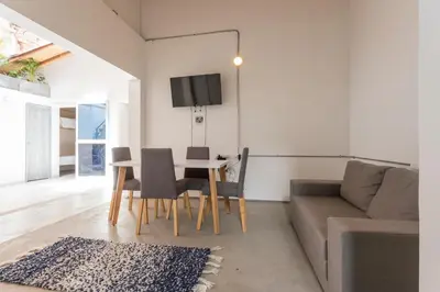 a living room with a table and a couch at Gastón Coliving in Medellín
