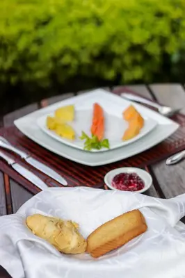 a table with two plates of food on it at Casa Lola Hotel Boutique in Salamina