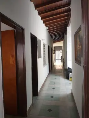 a hallway of a building with a tile floor at Big House Medellin in Medellín