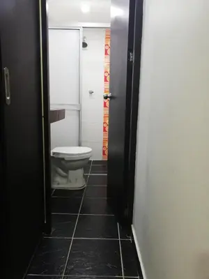 a bathroom with a toilet in a bathroom stall at APARTA ESTUDIO 7051 in Medellín