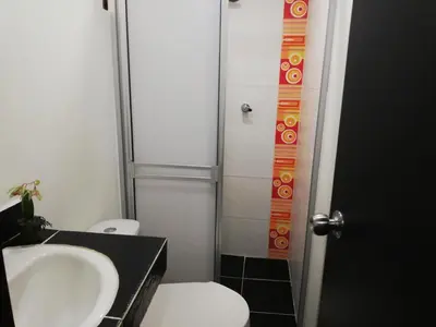 a bathroom with a sink and a toilet at APARTA ESTUDIO 7051 in Medellín