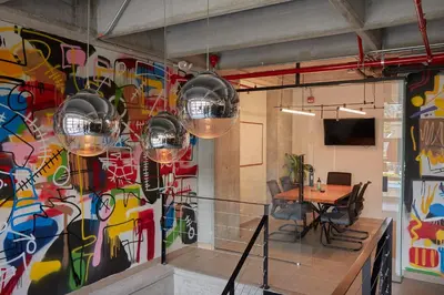 a room with a wall covered in graffiti at Factory Lofts Hotel in Medellín