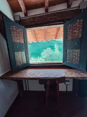 a window in a room with a table at Las Orquídeas EcoHostel in Guarne