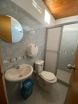 a bathroom with a toilet and a sink and a shower at Hotel imperial in Doradal