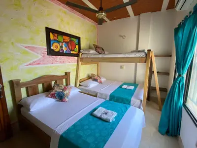 a bedroom with two bunk beds in a room at Hotel imperial in Doradal