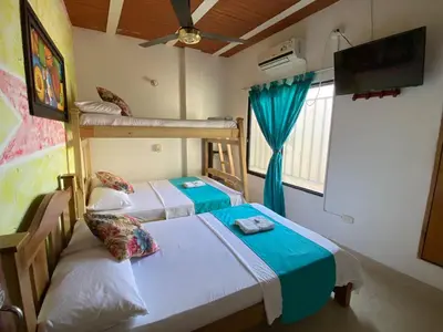 a bedroom with two bunk beds and a tv at Hotel imperial in Doradal