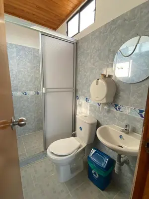 a bathroom with a toilet and a sink and a shower at Hotel imperial in Doradal