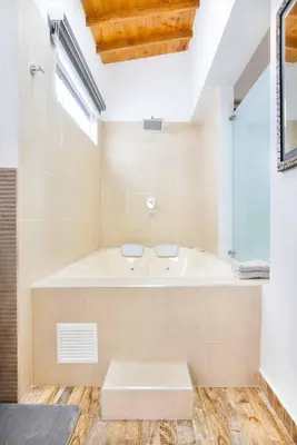 a bathroom with a tub and a window at Miracle in Medellín