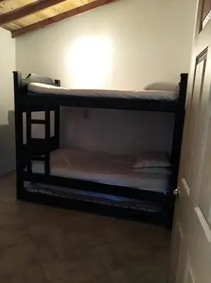 a couple of bunk beds in a room at Apartamento de Guatapé in Guatapé