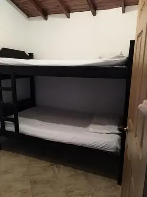 a couple of bunk beds in a room at Apartamento de Guatapé in Guatapé
