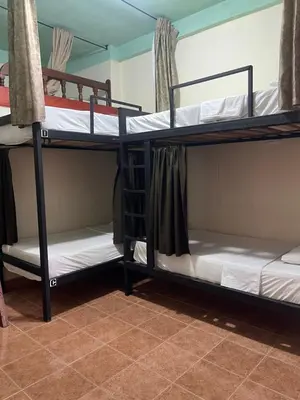 a room with three bunk beds in a dorm at Candileja by Origen Hostel in Jardin