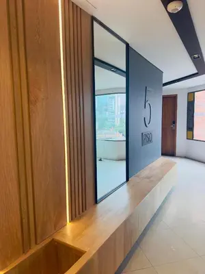 a hallway with a large window in a building at Hotel Casa Victoria in Medellín