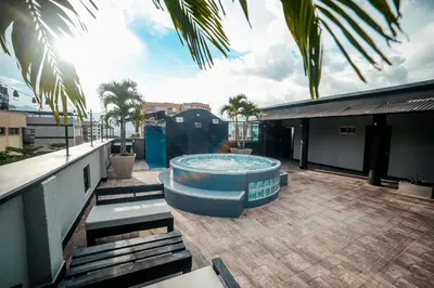 a hot tub on the roof of a building at Tik by Bernalo Hotels in Medellín