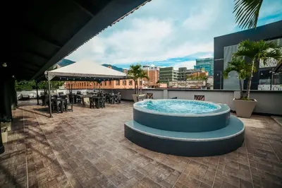a hot tub on the roof of a building at Tik by Bernalo Hotels in Medellín