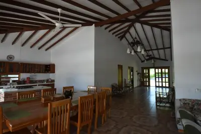 a dining room with a table and some chairs at Villa Ilusion 88 in Puerto Boyacá